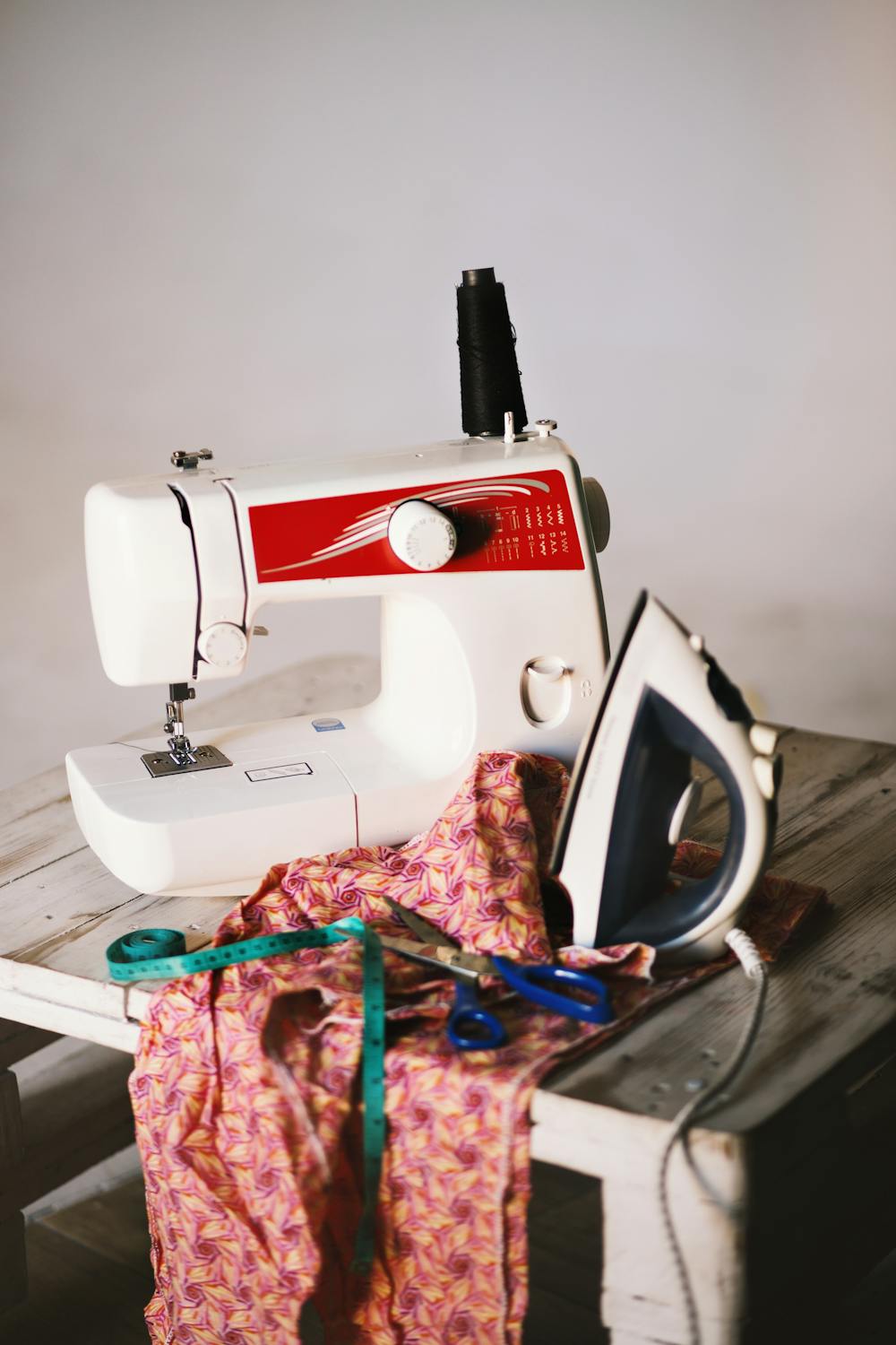 Sewing machine with fabric and care tools for clothing labels guide