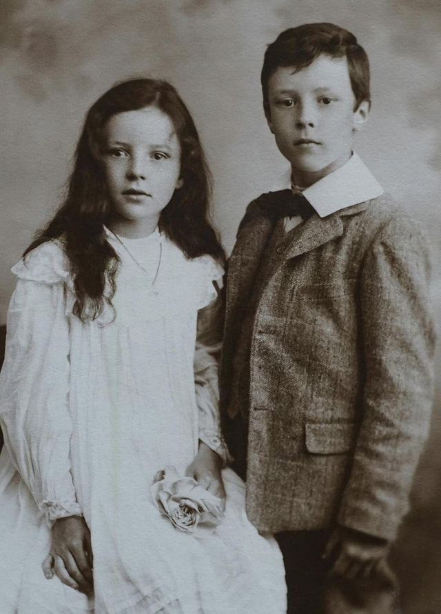 Lovely siblings in matching vintage style outfits together