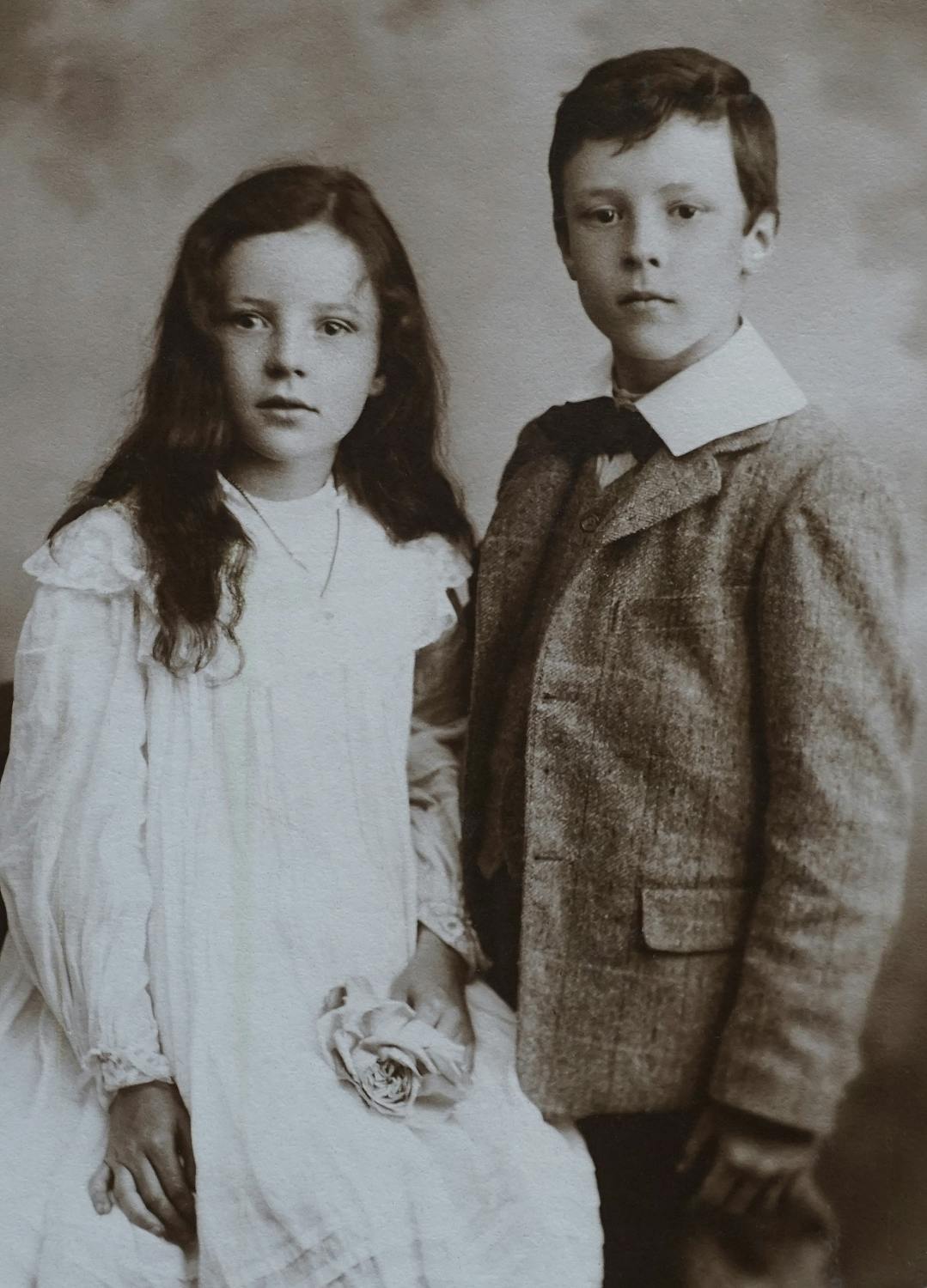 Lovely siblings in matching vintage style outfits together