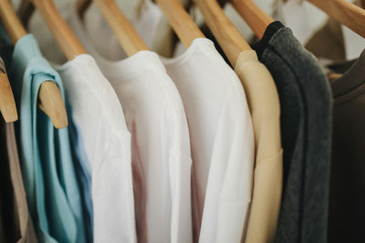 Beautifully organized kids wardrobe closet in soft pastel arrangement