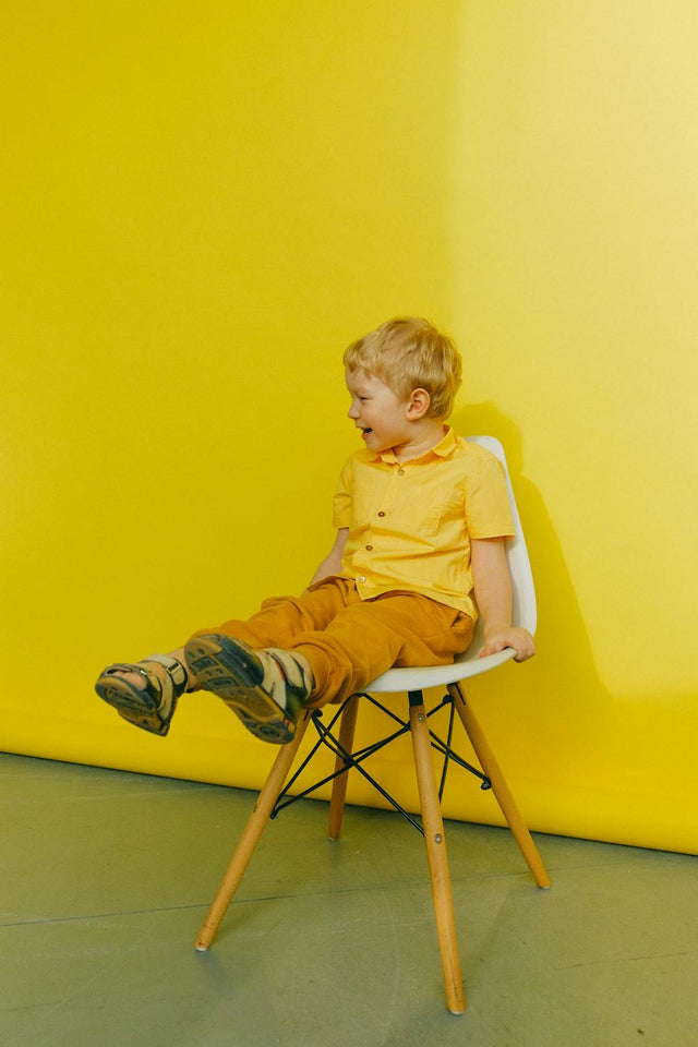 Cozy winter layered kids clothes in warm soft tones