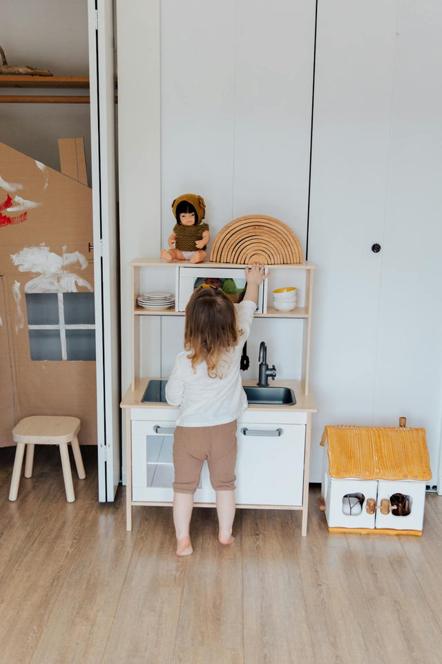 Excited toddler on first day of playschool in adorable outfit