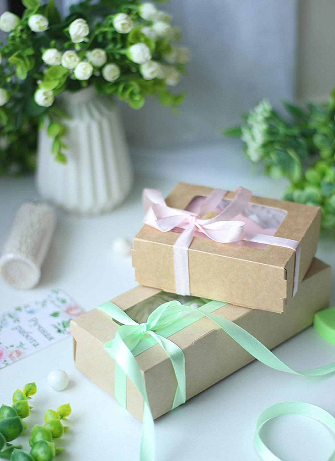 Beautiful gift boxes with pastel ribbons for girls clothing gift guide
